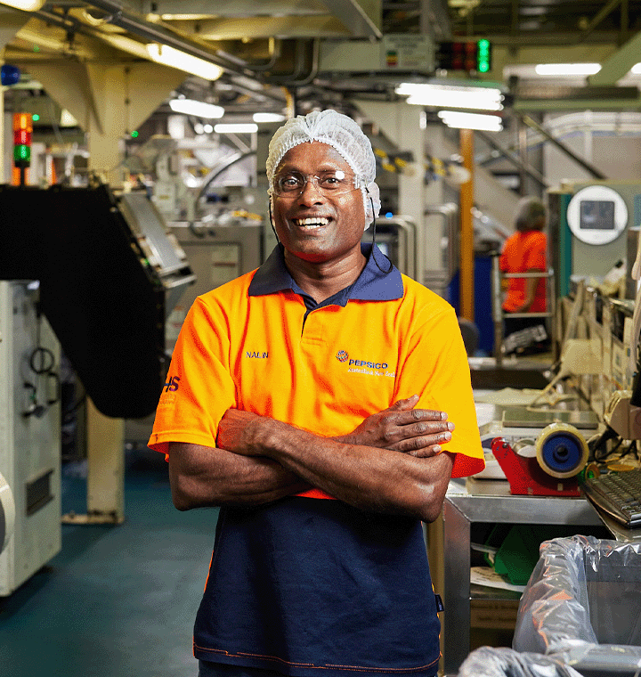 Team member standing in a facility